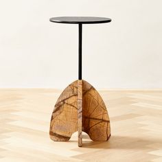 a wooden table with a piece of wood in the shape of an lungs on it