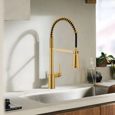 the kitchen sink is clean and ready to be used as a counter top faucet