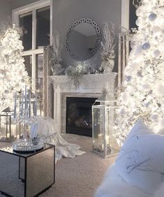 a living room filled with white christmas decorations