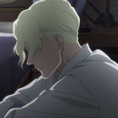 an anime character with blonde hair sitting in front of a bed and looking at something