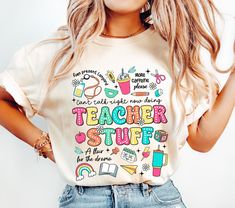 a woman wearing a teacher stuff t - shirt