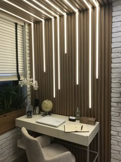 a white desk and chair in front of a wall with wooden slats on it