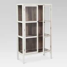 a white and wood bookcase with four shelves on each side, in front of a gray background