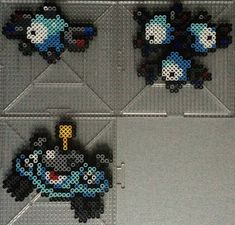 four pixellated images of pokemons on display