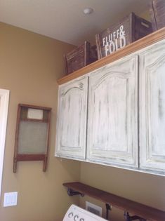 a white washer and dryer sitting next to each other in a laundry room