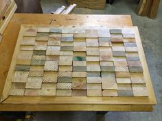 a wooden table topped with lots of wood pieces