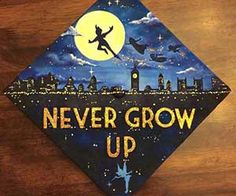 a graduation cap with the words never grow up on it and an image of a witch flying over a city at night