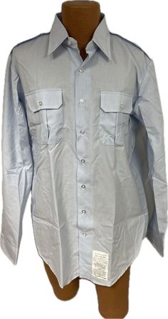 U.S. Air Force Issue Long Sleeve Dress Shirt Current Issue - USAF Shade 1550 Size: 17 x 38 (17 inch neck and 38 inch sleeve length) Condition: New Fitted Light Blue Long Sleeve Shirt, Light Blue Fitted Long Sleeve Shirt, Light Blue Long Sleeve Shirt For Daytime, Business Blue Shirt With Pockets, Blue Business Shirt With Pockets, Fitted Shirt With Pockets And Casual Collar, Light Blue Long Sleeve Shirt For Semi-formal Occasions, Fitted Shirt With Pockets And Spread Collar, Long Sleeve Dress Shirt With Pockets For Work