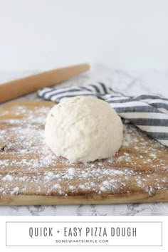 a doughnut sitting on top of a wooden cutting board