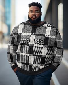 a man with glasses and a sweater is standing on the street in front of a building