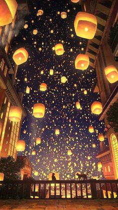 many lanterns are floating in the air