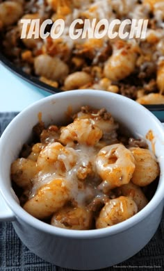 a close up of a bowl of food on a table with the words taco gnocchi