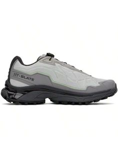 Salomon 
Gray XT-Slate Advanced Sneakers 
Low-top textured mesh sneakers in gray. 
. Bonded trim throughout 
. Quicklace™ closure 
. Logo patch at padded tongue 
. Logo embossed at sides 
. Logo printed at sides and heel 
. Mesh lining 
. Molded OrthoLite® insole 
. Agile Chassis™ System rubber midsole 
. Treaded Contagrip® rubber sole 
Supplier color: Metal/Gray flannel/Cameo green 
Upper: textile. Sole: rubber. 
Made in China. 
241837M237064 
Gray XT-Slate Advanced Sneakers default         Spo Sporty Gray Sneakers With Rubber Waffle Outsoles, Gray Dynamic Sneakers With Laces, Dynamic Gray Sneakers With Laces, Gray Dynamic Sneakers, Dynamic Gray Sneakers, Gray Sporty Sneakers With Boost Technology, Gray Sporty Sneakers With Boost Midsole, Athleisure Trail Running Shoes With Laces For Streetwear, Gray Sneakers With Rubber Sole For Light Sports