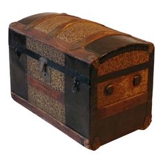 an old trunk with leopard print on the top and sides, is sitting in front of a white background