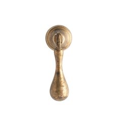 an old brass door handle on a white background