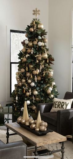 a living room with a christmas tree in the corner and decorations on the coffee table