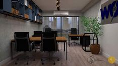 an office with wooden floors and black chairs