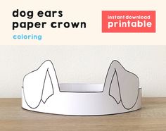 a dog ears paper crown is shown on a table with the text, printable