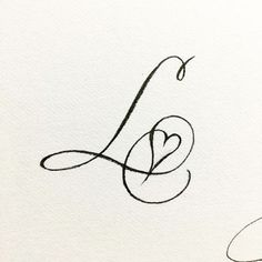 the letter l is written in cursive writing with a heart on it's side