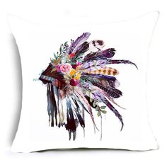 a pillow with feathers and flowers on it