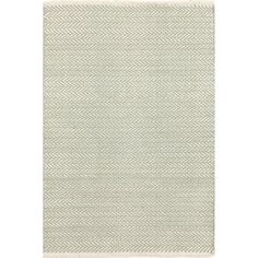 a white rug with an arrow pattern on the front and back of it, in grey tones