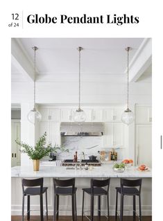 an image of a kitchen with white cabinets and marble counter tops on the cover of globe pendant lights