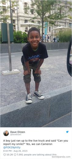 a young boy standing on top of a cement slab