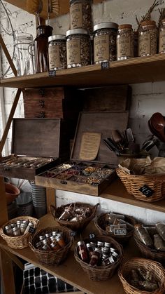 many baskets and containers are on shelves in a room with other items, such as jars