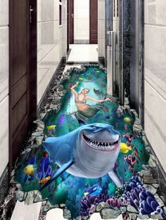 the bathroom floor is painted with an image of a shark and other sea creatures on it