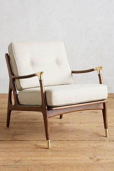 a white chair sitting on top of a wooden floor