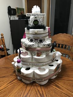 a stack of toilet paper stacked on top of each other with eye glasses on them