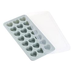 a heart shaped ice cube tray on a white background with a clear plastic cover over it