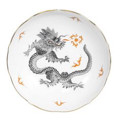 Symbolizing preternatural wisdom, the spirit of change, sun, light and the male power of the yang, the Chinese Ming dragon is one of the oldest and most popular designs by Meissen.  Although created in 1740 based on Asian templates, its interpretation on clear, architectural shapes and a gold rim gives it a more classic look.  Note the dragon with four toes: these were originally reserved for items used by royal princes in ancient China.  Founded in 1710 by King Augustus the Strong, Meissen is t Cleaning Dishwasher, Pink Dinner Plates, Dragon Black, Tea Saucer, Baccarat Crystal, Gold Monogram, Dinner Plate Sets, Ancient China, Hinged Bangle