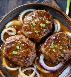 some meatballs and onions are in a bowl