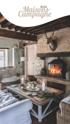 a living room filled with furniture and a fire place next to a couch in front of a fireplace