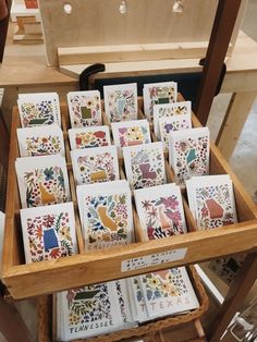 many cards are arranged in a wooden box