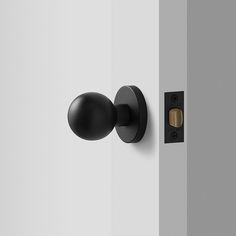 an open door with a black handle and knob