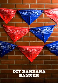 red, white and blue bandana banners hanging on a brick wall with the words diy bandana banner