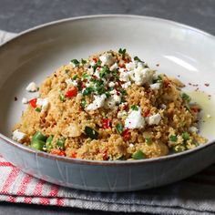 a white bowl filled with food on top of a table