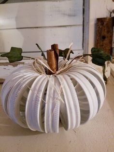 a white pumpkin sitting on top of a table