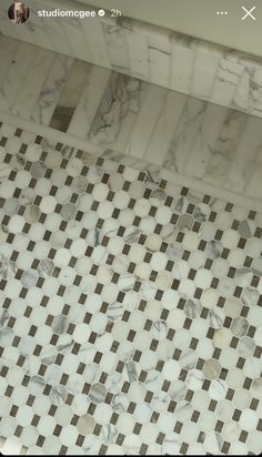 an overhead view of a bathroom with marble tiles