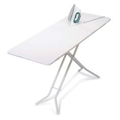 a white ironing board sitting on top of a table