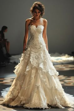 a woman is walking down the runway in a wedding dress