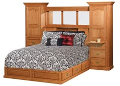 a bedroom with a bed, dressers and drawers in it's center area