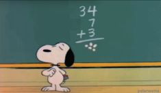 a cartoon dog standing in front of a chalkboard with numbers written on the board