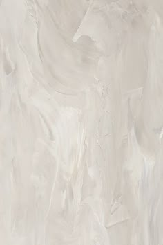 a white marble textured wallpaper with grey and beige paint streaks on the walls