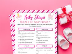 a pink and white baby shower game with shoes next to it