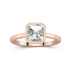 a rose gold engagement ring with an octagonal cut diamond in the center, on a white background