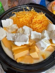 cheese and other ingredients in a bowl on a table