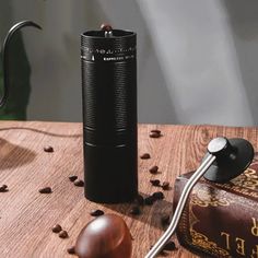 a coffee grinder sitting on top of a wooden table